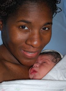 New mom with her baby after a home birth with Rainy City